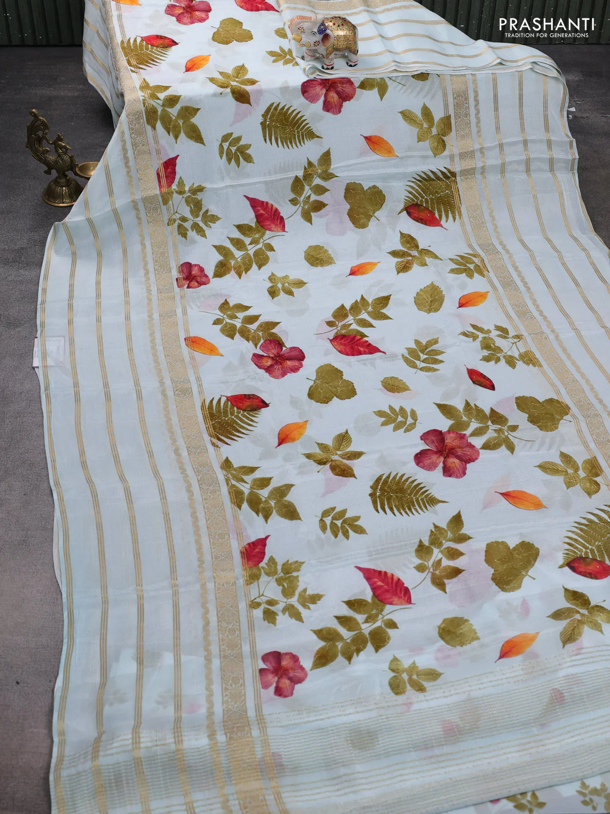Semi georgette saree teal blue with allover floral prints and long zari woven border - Image 2