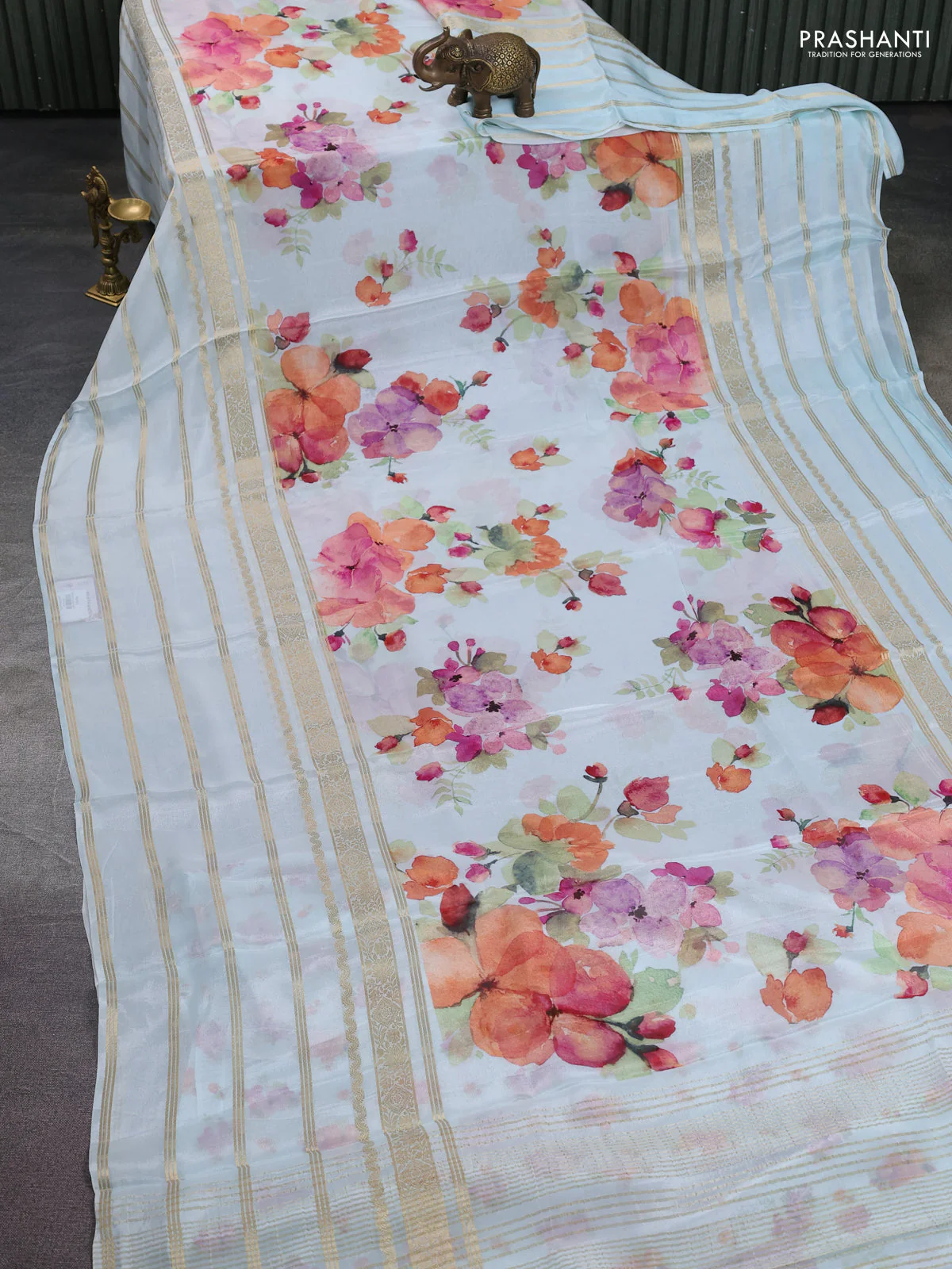 Semi georgette saree teal blue with allover floral prints and long zari woven border - Image 2