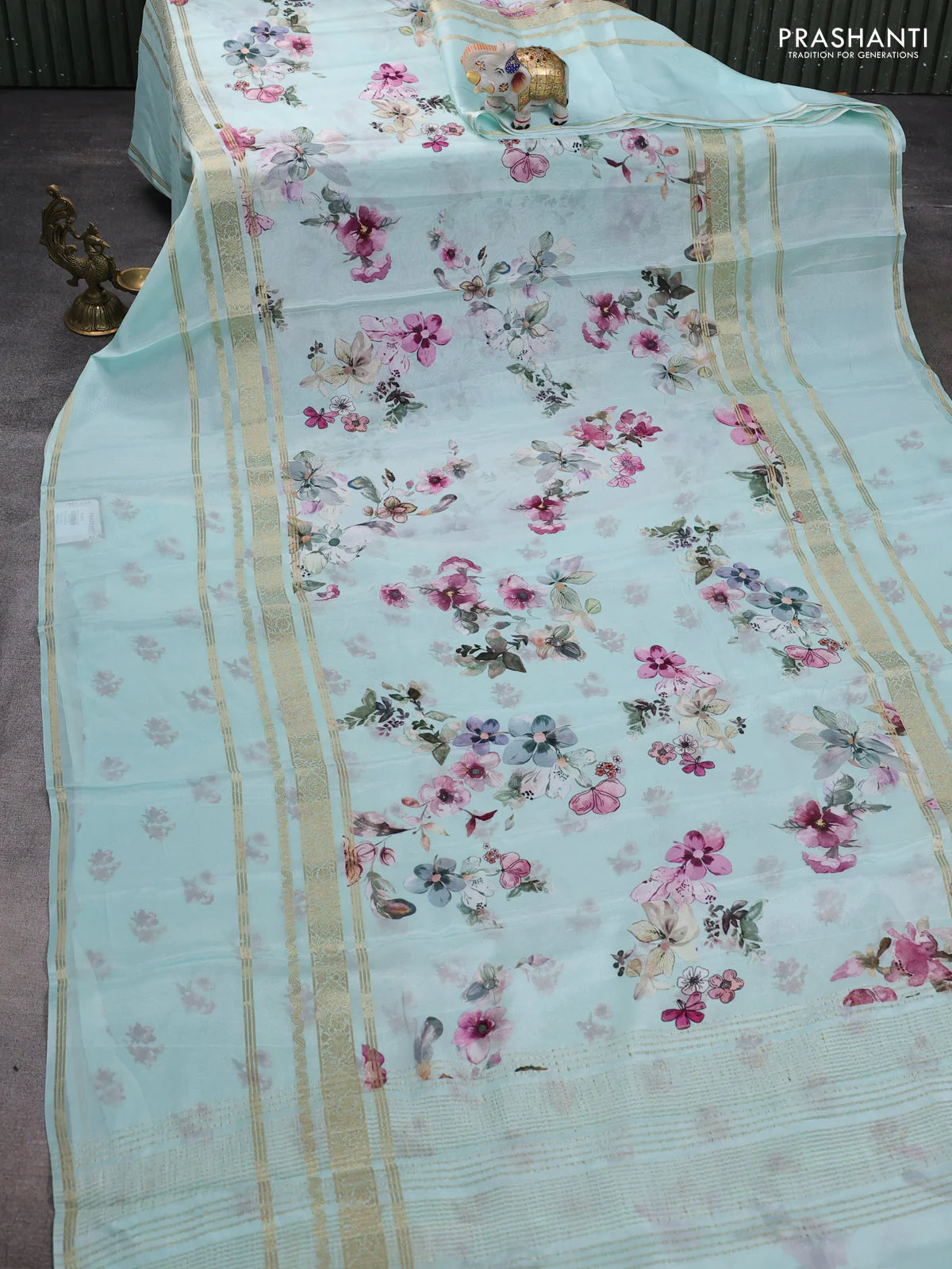 Semi georgette saree teal green shade with allover floral prints and long zari woven border - Image 2