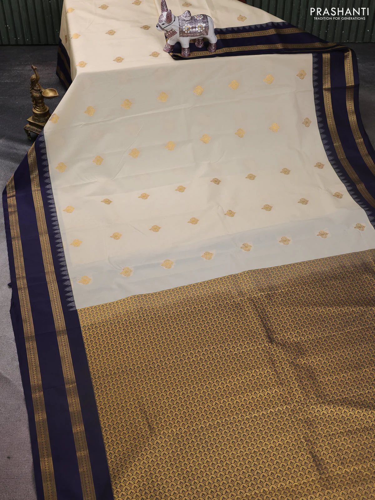 Semi kanchipuram silk saree cream and navy blue with zari woven buttas and temple design rettapet zari woven border - Image 2