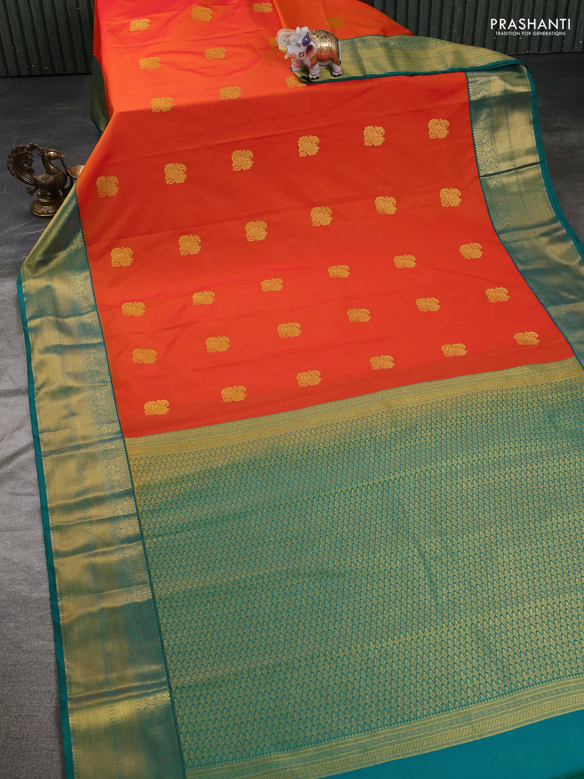 Semi kanchipuram silk saree dual shade of orange and teal green with zari woven buttas and zari woven korvai border - Image 2