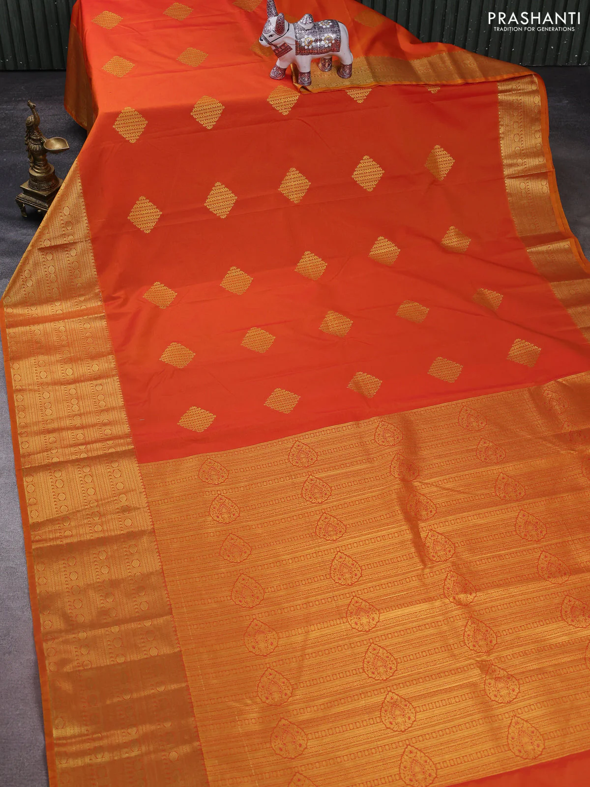 Semi kanchipuram silk saree orange with zari woven buttas and long zari woven border - Image 2