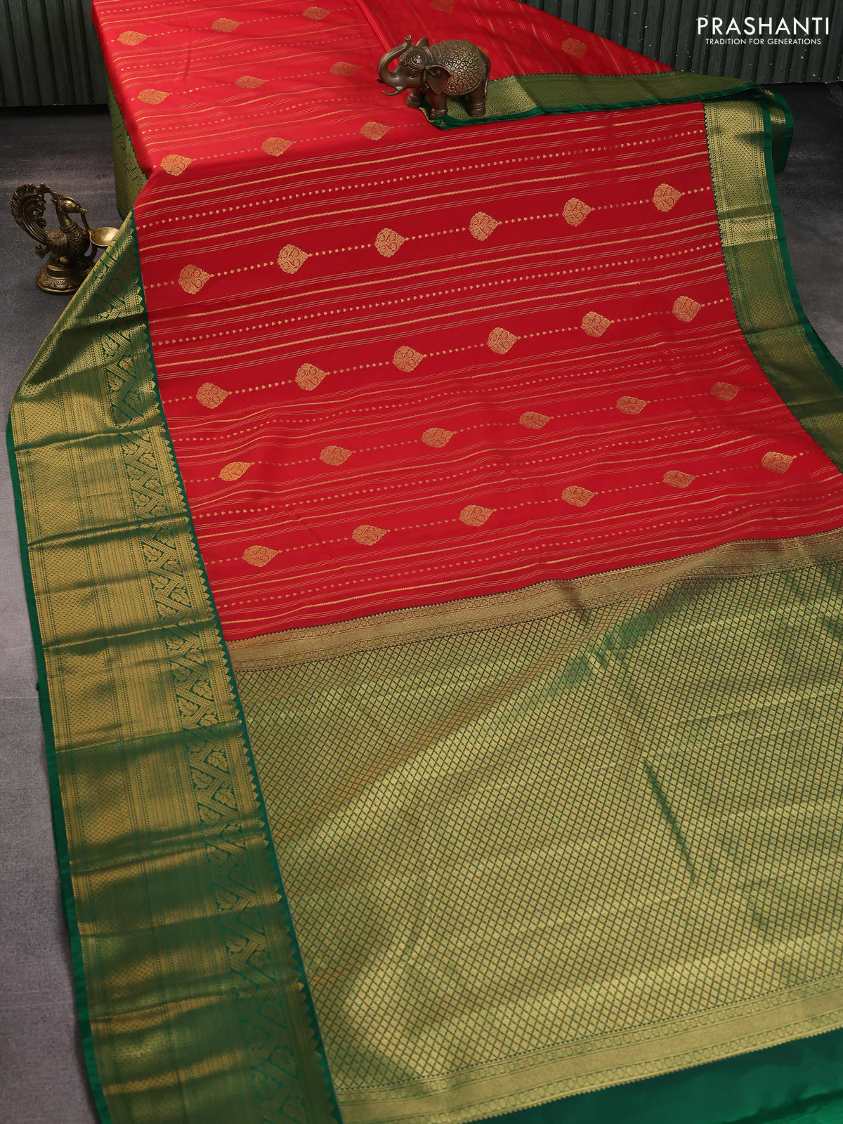 Semi kanchipuram silk saree tomato red and green with allover zari stripes pattern & buttas and long zari woven korvai border - Image 2