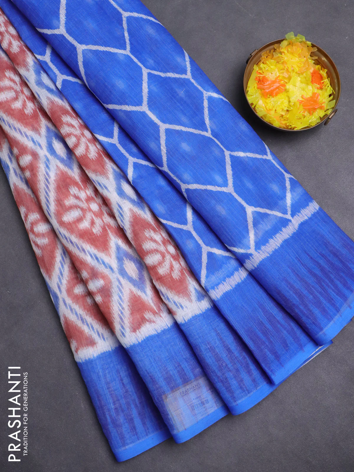 Semi linen saree off white rust and blue with allover ikat prints and printed border
