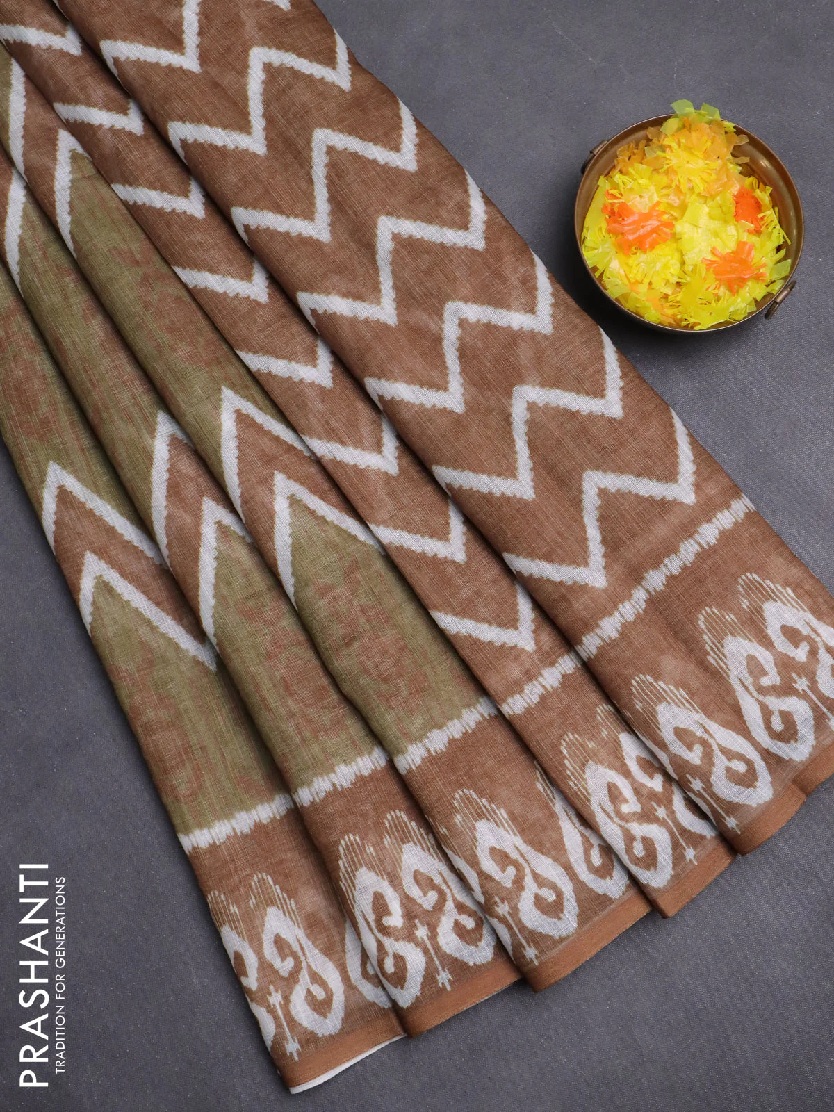 Semi linen saree sap green and dark mustard with allover ikat prints and printed border