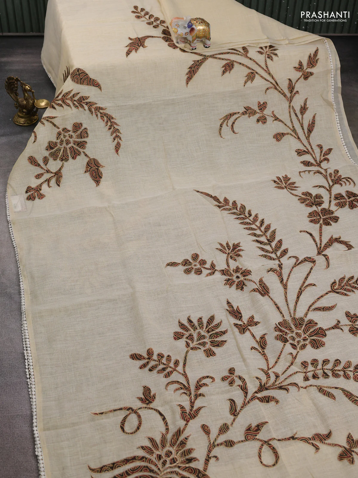 Semi linen tissue saree cream and brown with applique work and crocia lace work border - Image 2