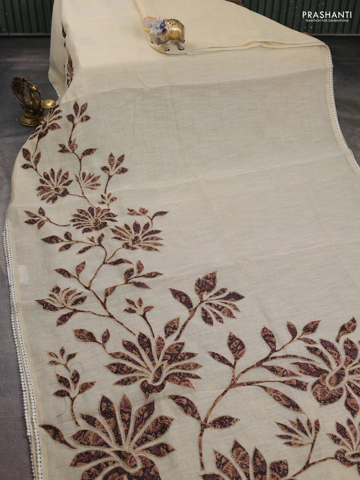 Semi linen tissue saree cream and coffee brown with kalamkari applique work and crocia lace work border - Image 2