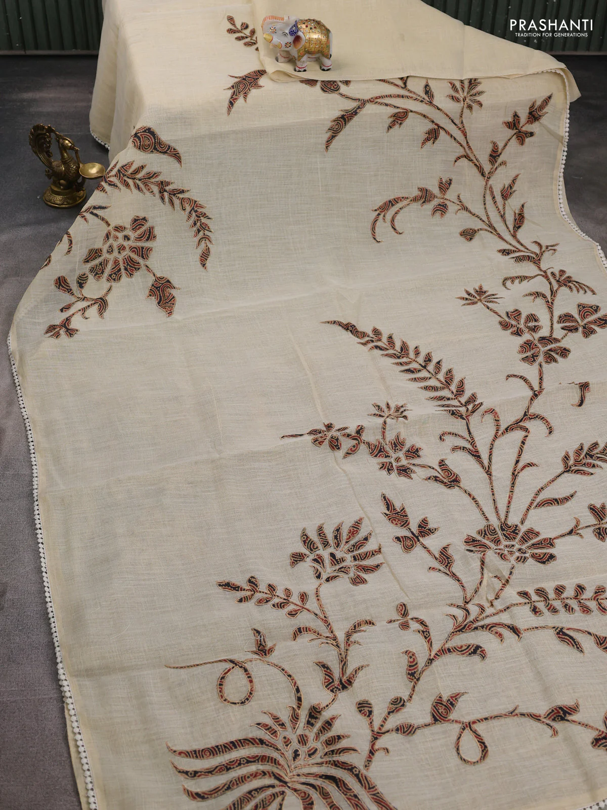 Semi linen tissue saree cream and deep jamun with applique work and crocia lace work border - Image 2