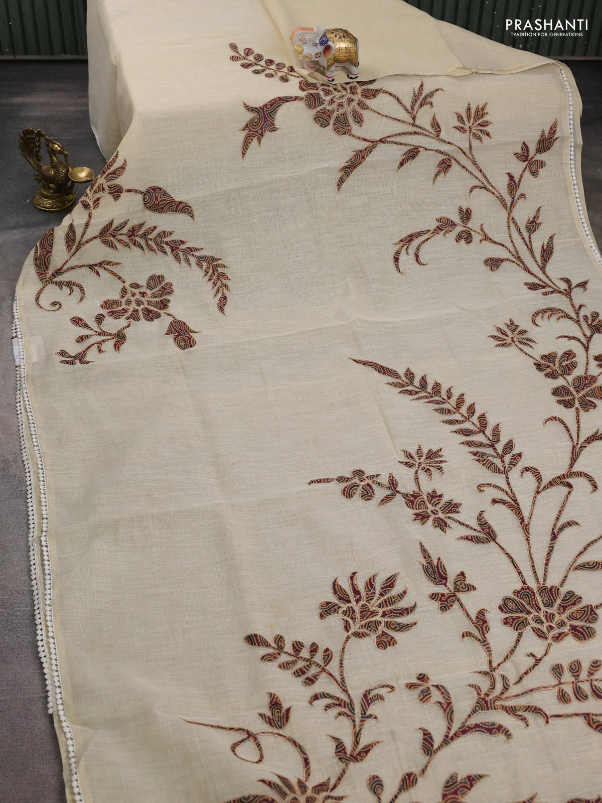 Semi linen tissue saree cream and wine shade with applique work and crocia lace work border - Image 2