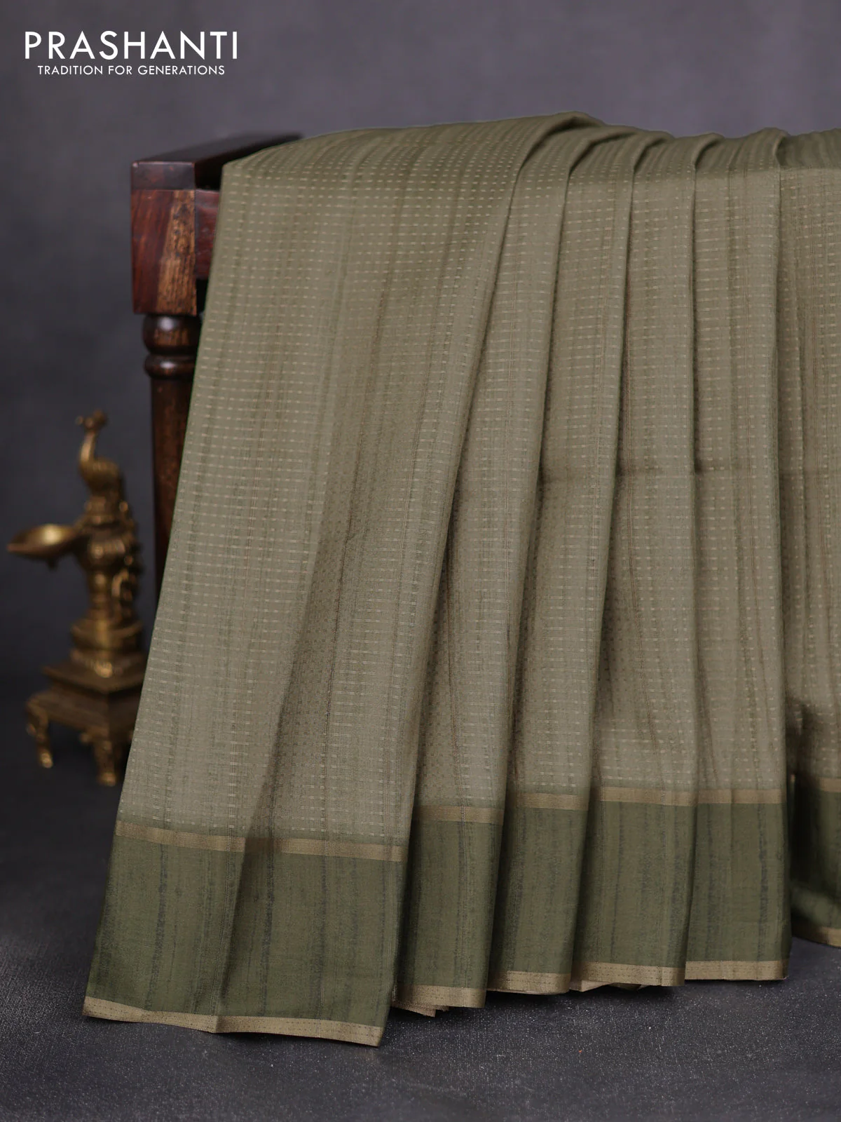 Semi matka saree green with allover zari weaves and rettapet zari woven border