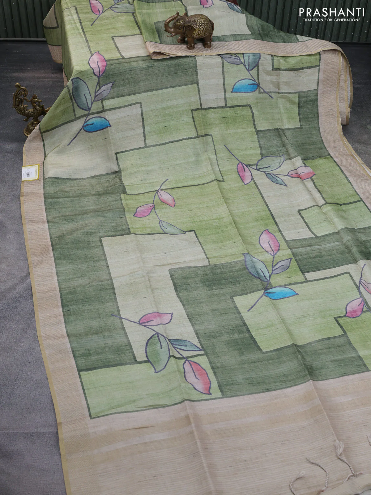 Semi matka saree pastel green and green beige with allover geometric prints and zari woven border