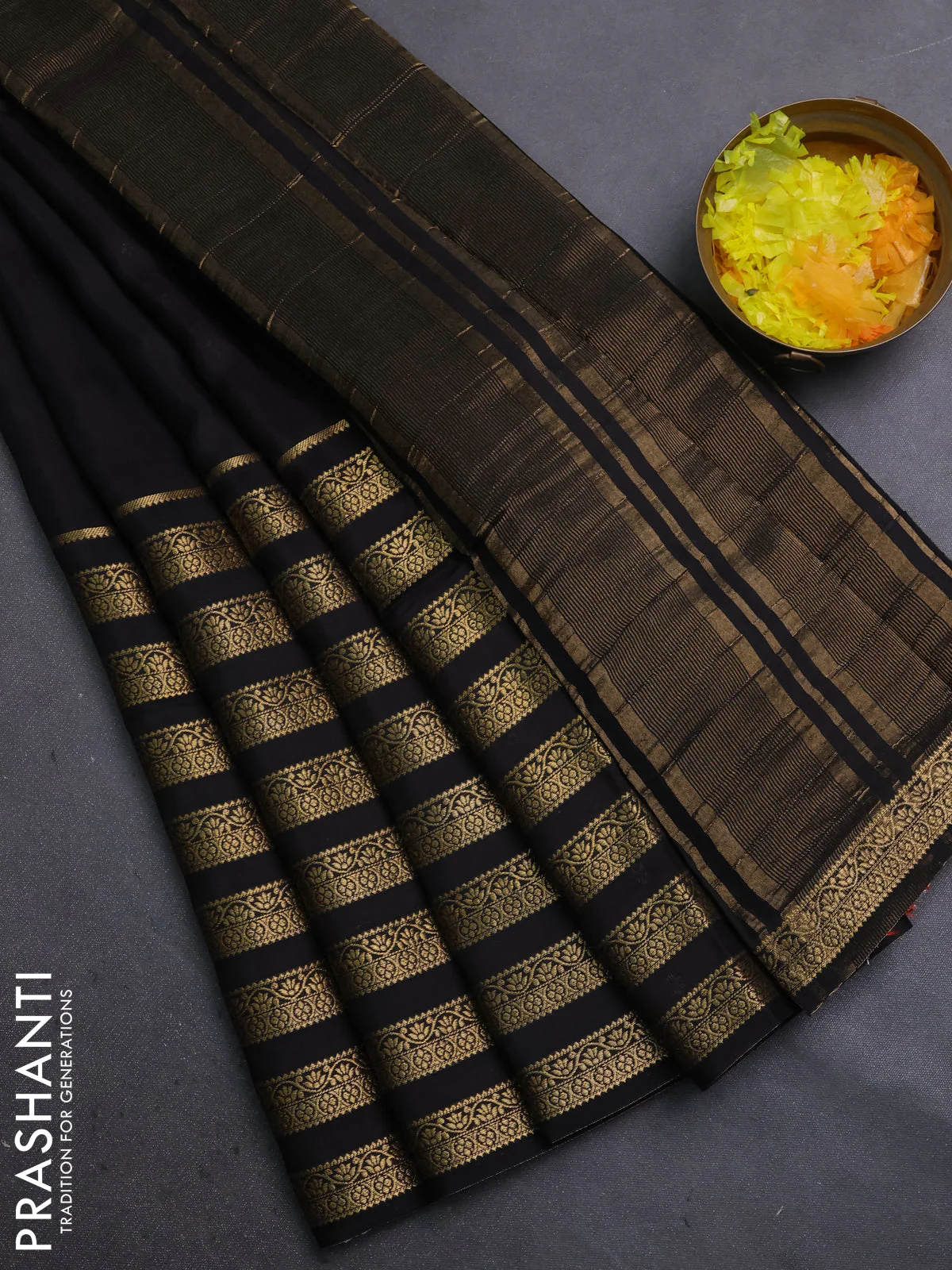 Semi mysore silk saree black and orange with plain body and long zari woven border