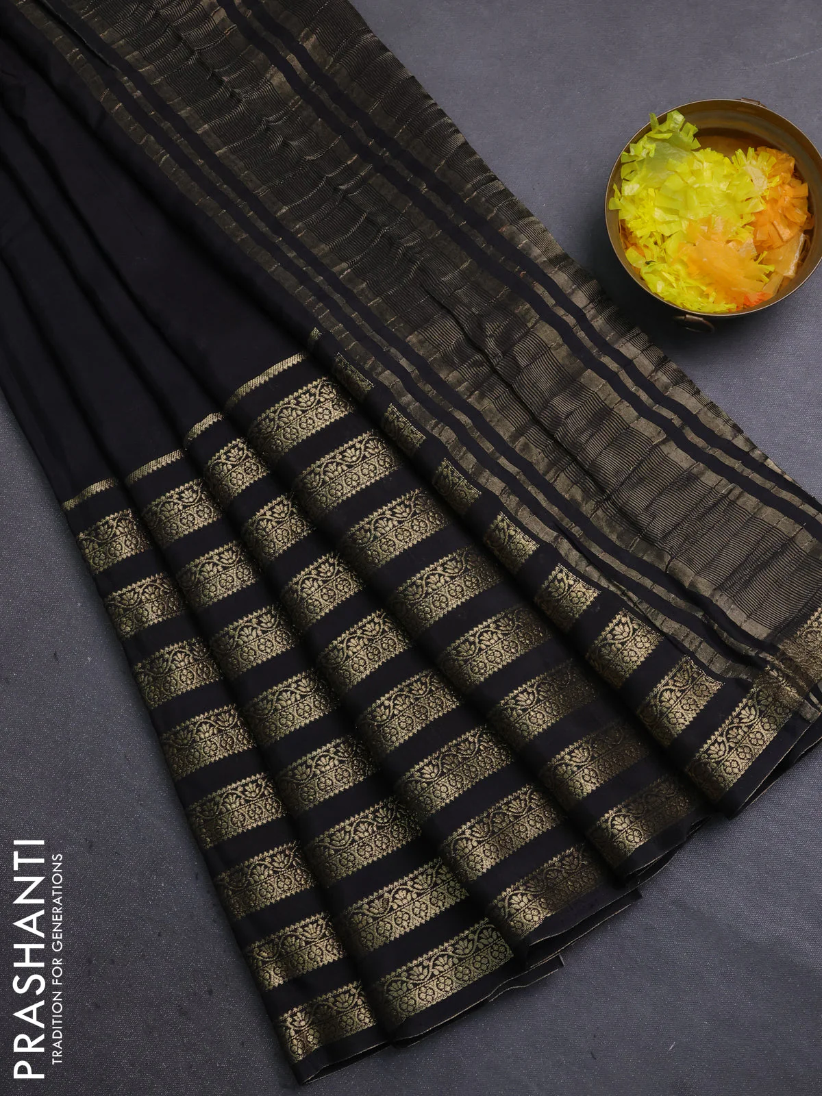 Semi mysore silk saree black and orange with plain body and long zari woven border