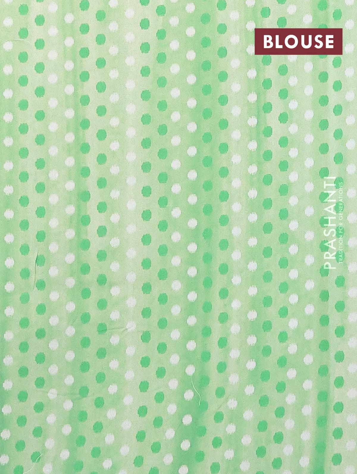 Semi orangza saree off white and green with allover ikat prints & embroidery buttas and crocia lace border - Image 4