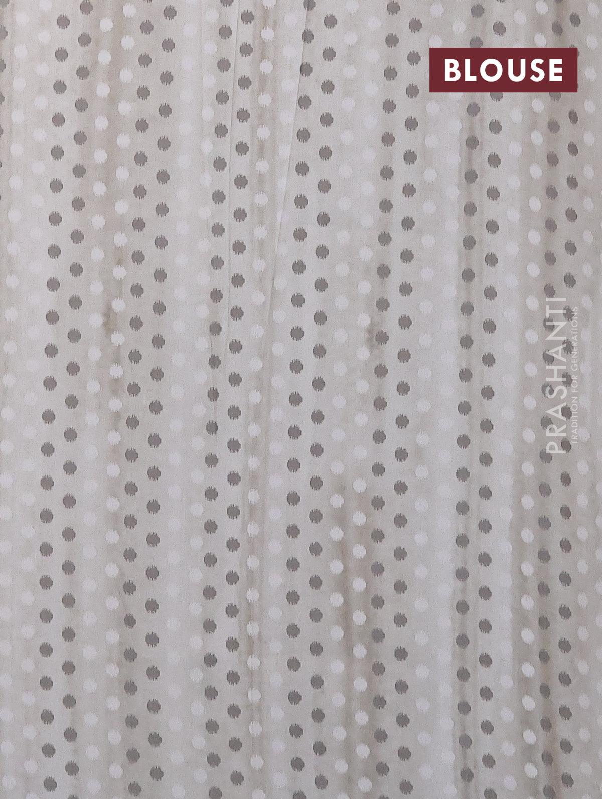 Semi orangza saree off white and grey with allover ikat prints & embroidery buttas and crocia lace border - Image 4