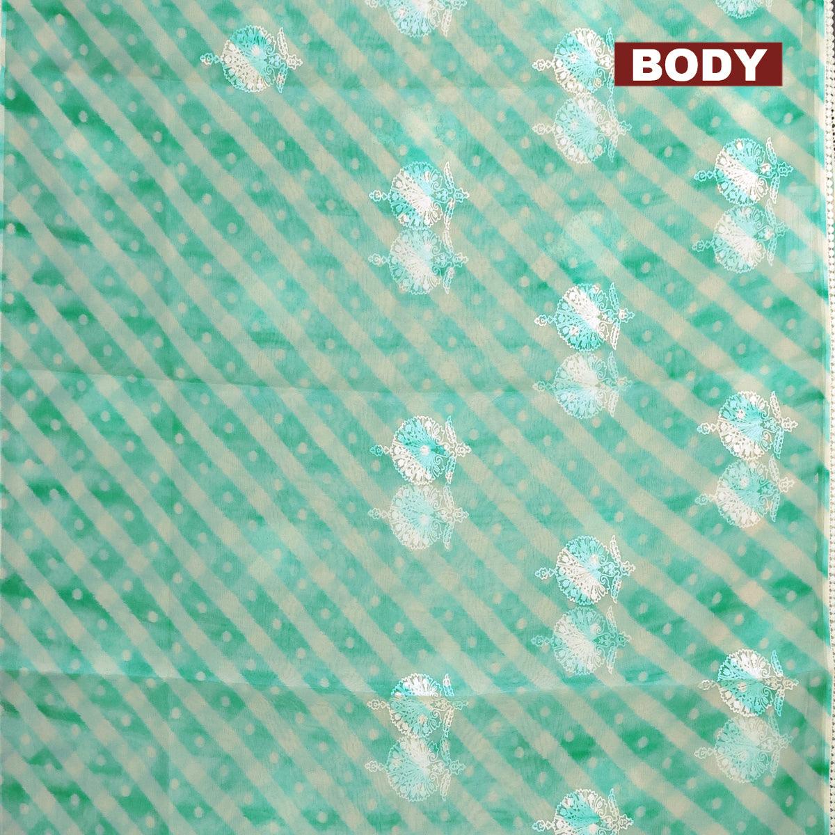 Semi orangza saree off white and teal blue with allover ikat prints & embroidery buttas and crocia lace border - Image 2