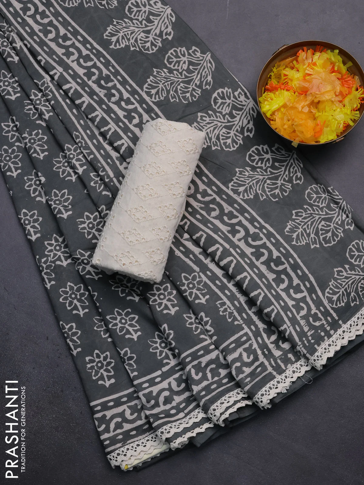 Semi pashmina silk saree grey and cream with allover floral butta prints and crocia lace work border