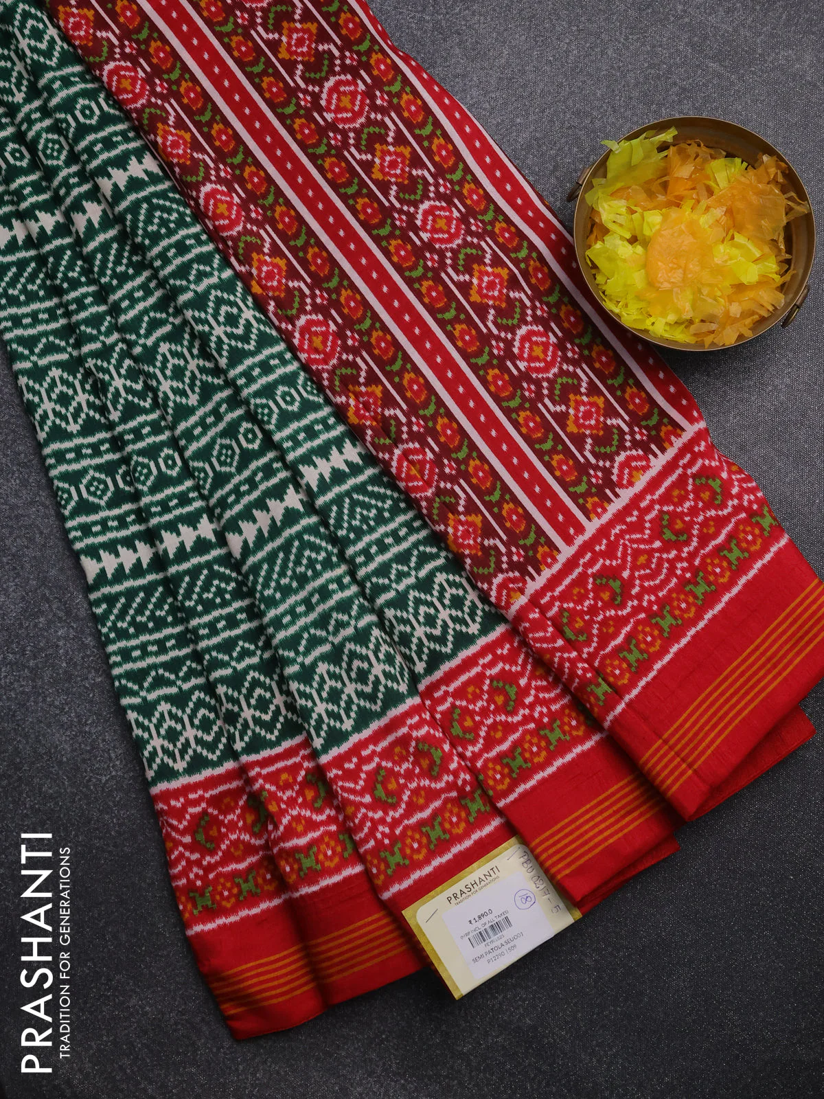 Semi patola saree green and red with allover ikat prints and simple border