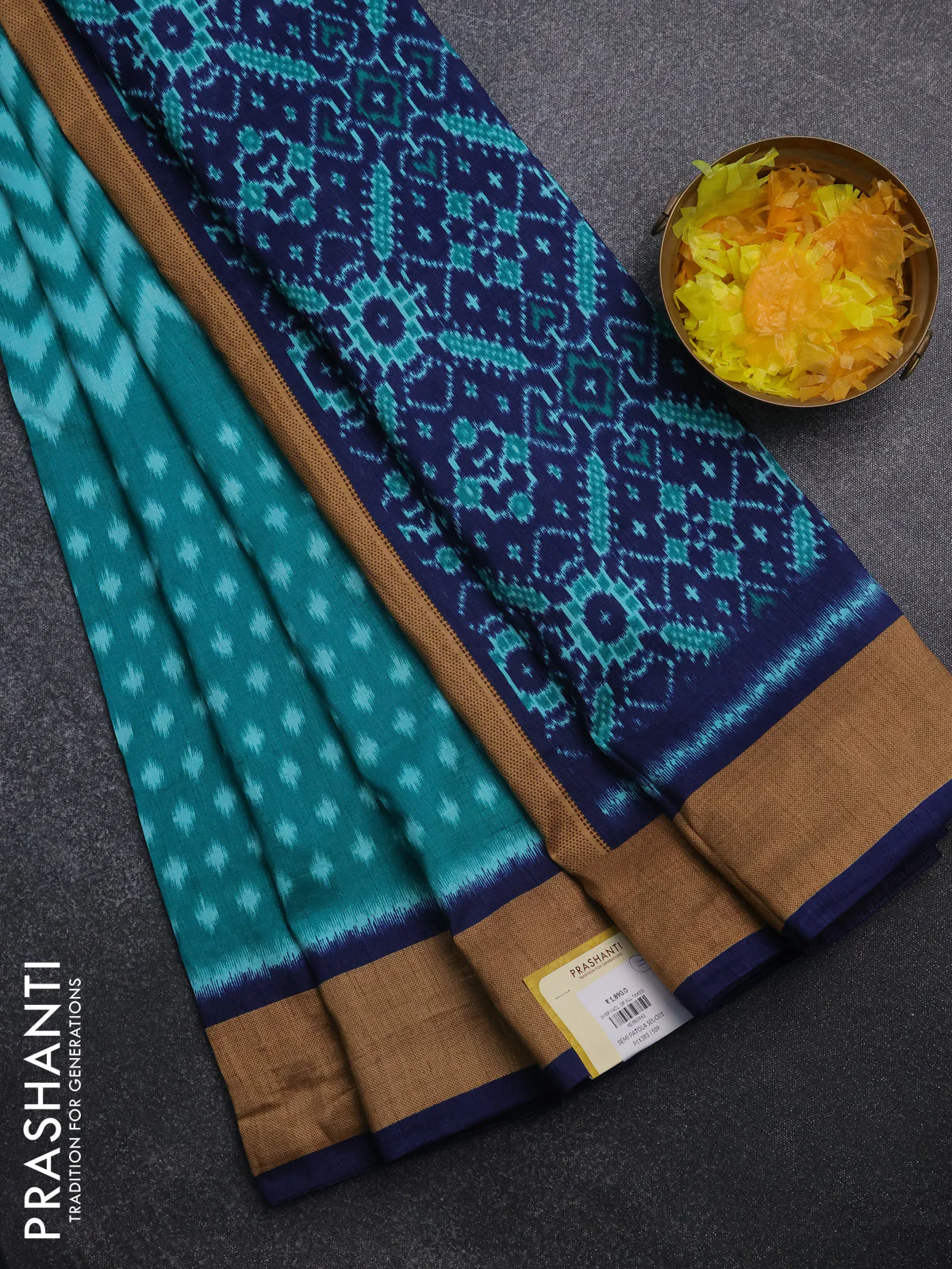 Semi patola saree teal green and navy blue with allover ikat weaves and woven border
