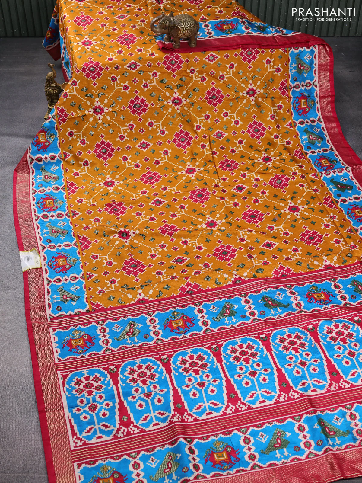 Semi pochampally saree mustard yellow and pink with allover patola prints and zari woven border - Image 2