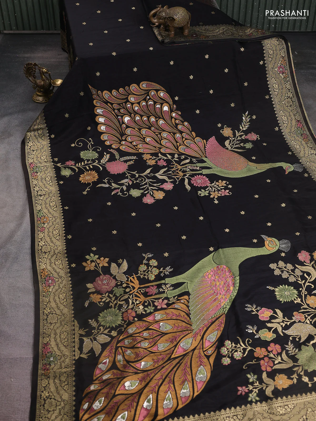 Semi raw silk saree black and allover jamdhani weaves and zari woven border
