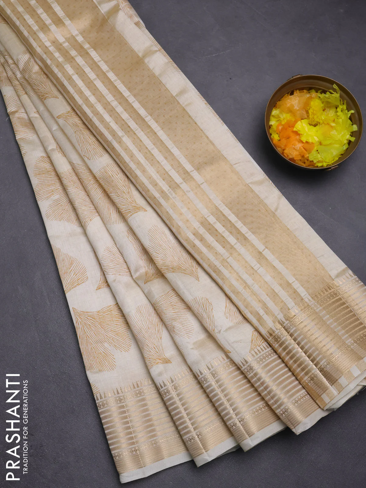 Semi raw silk saree cream with butta prints and zari woven border