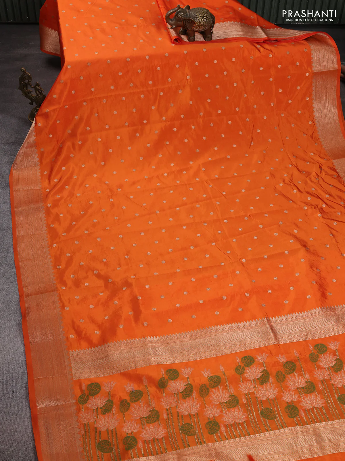 Semi raw silk saree orange with allover zari woven buttas and zari woven border - Image 2