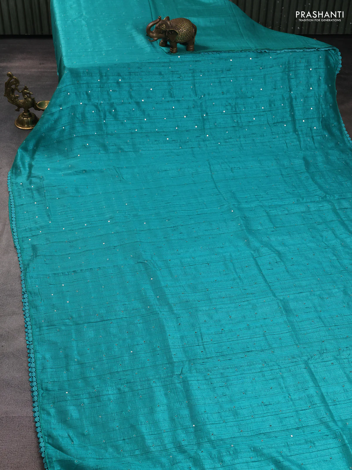 Semi raw silk saree teal blue with allover mirror work and lace work border - Image 2