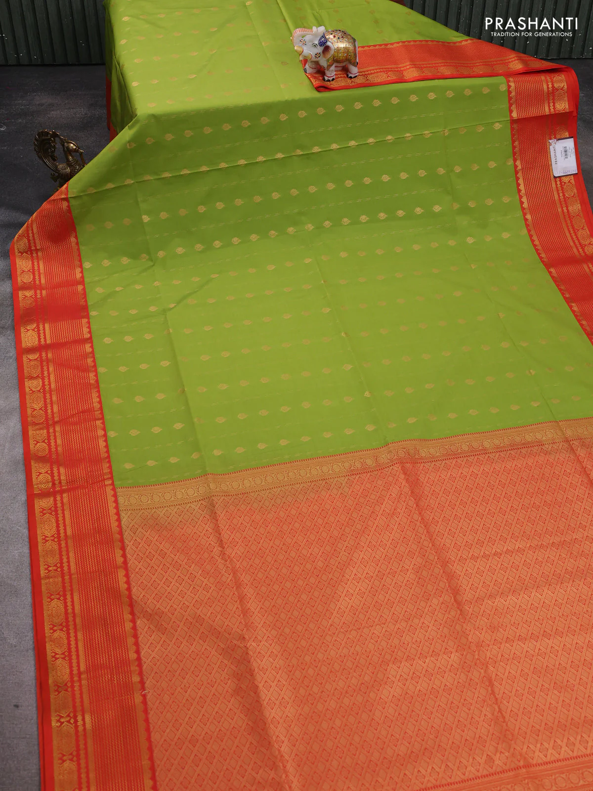 Semi soft silk saree light green and orange with allover zari woven buttas and zari woven border - Image 2