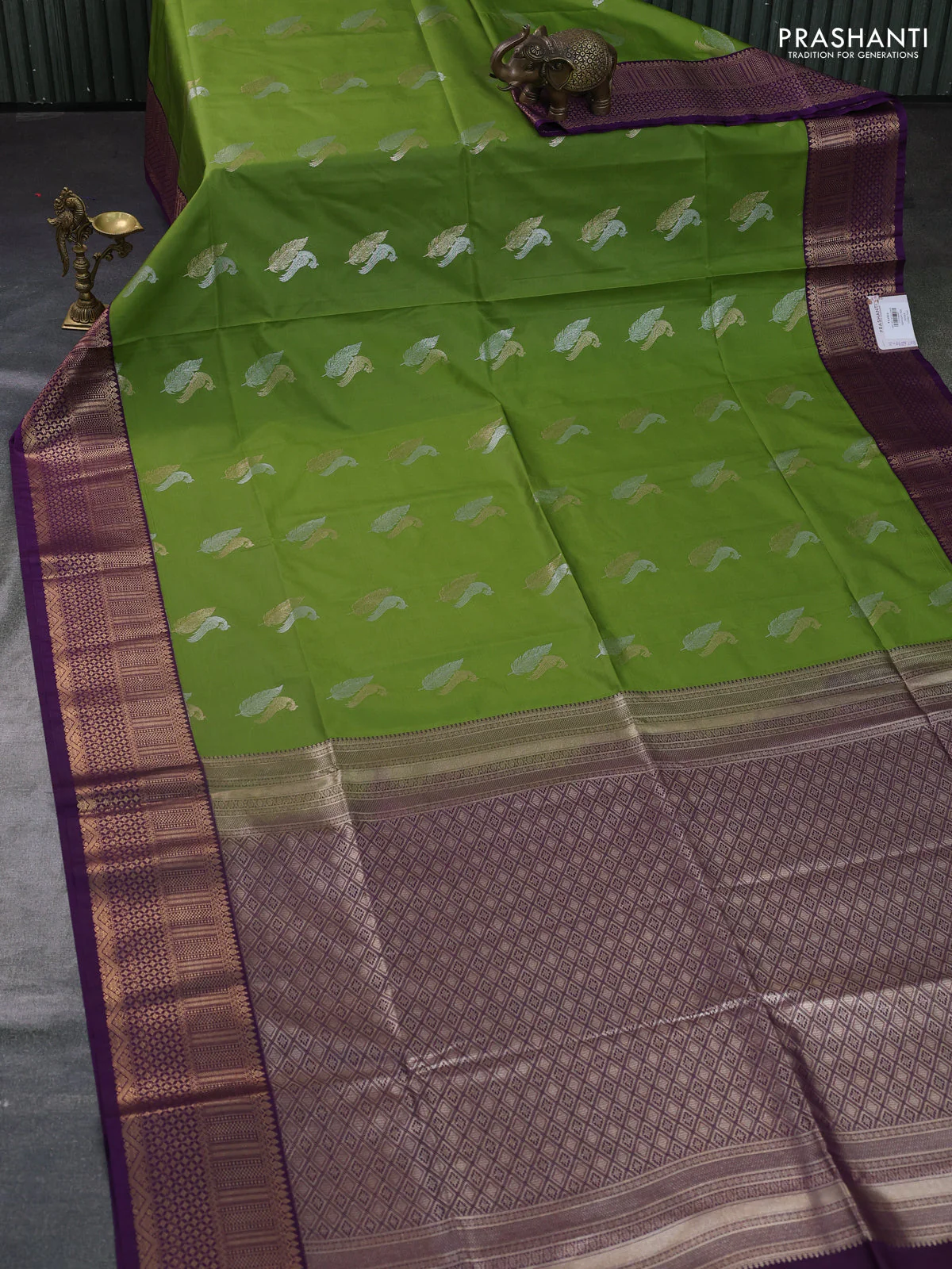 Semi soft silk saree light green and purple with zari woven buttas and zari woven border - Image 2
