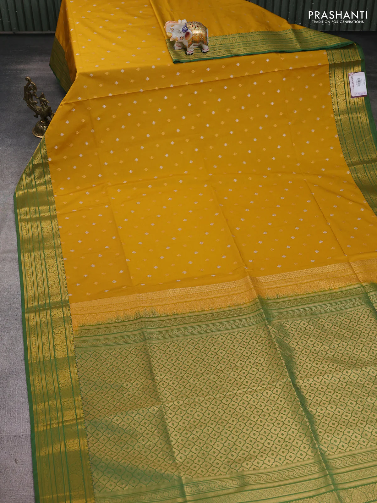 Semi soft silk saree mustard yellow and green with allover zari woven buttas and zari woven korvai border - Image 2