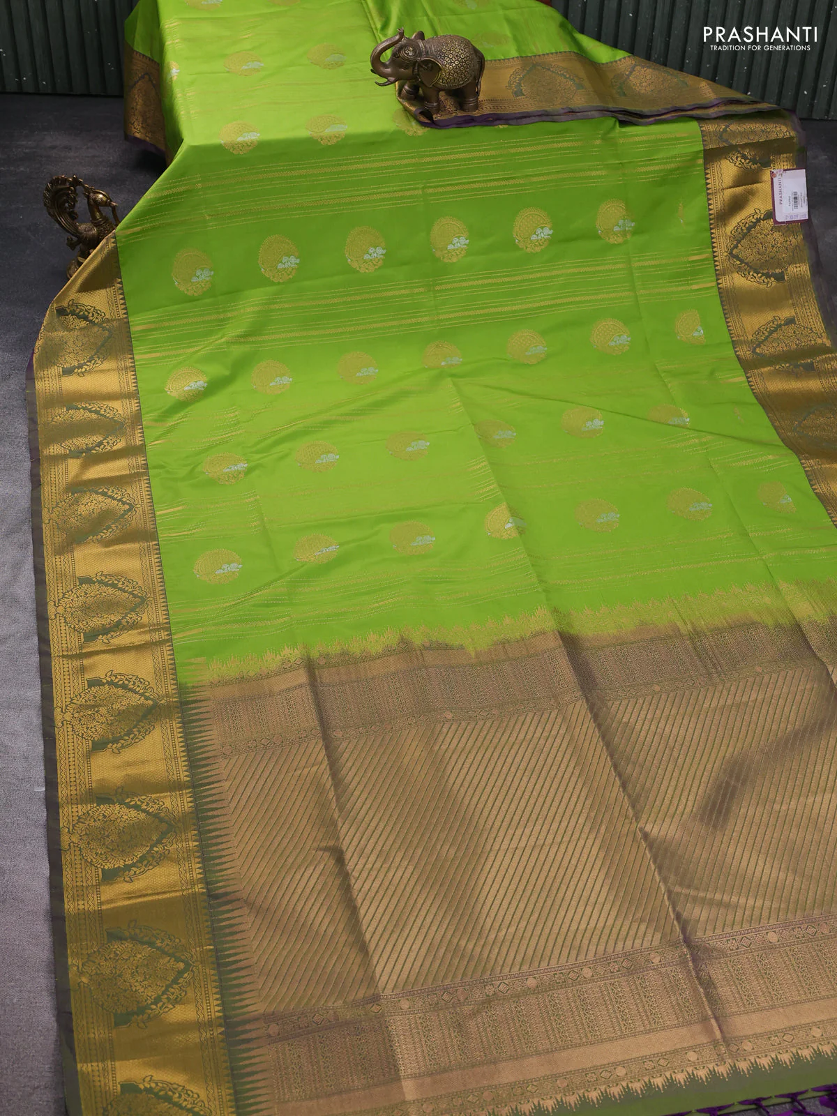 Semi soft silk saree parrot green and dual shade of greenish purple with allover zari weaves & buttas and zari woven butta korvai border - Image 2