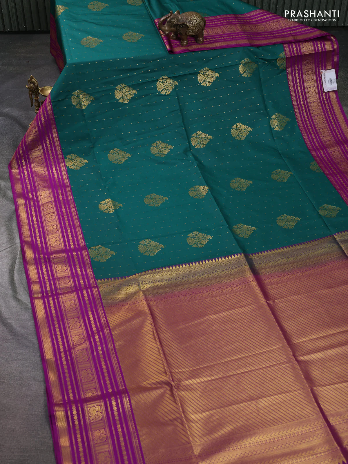 Semi soft silk saree peacock green and violet with allover zari woven buttas and long zari woven border - Image 2