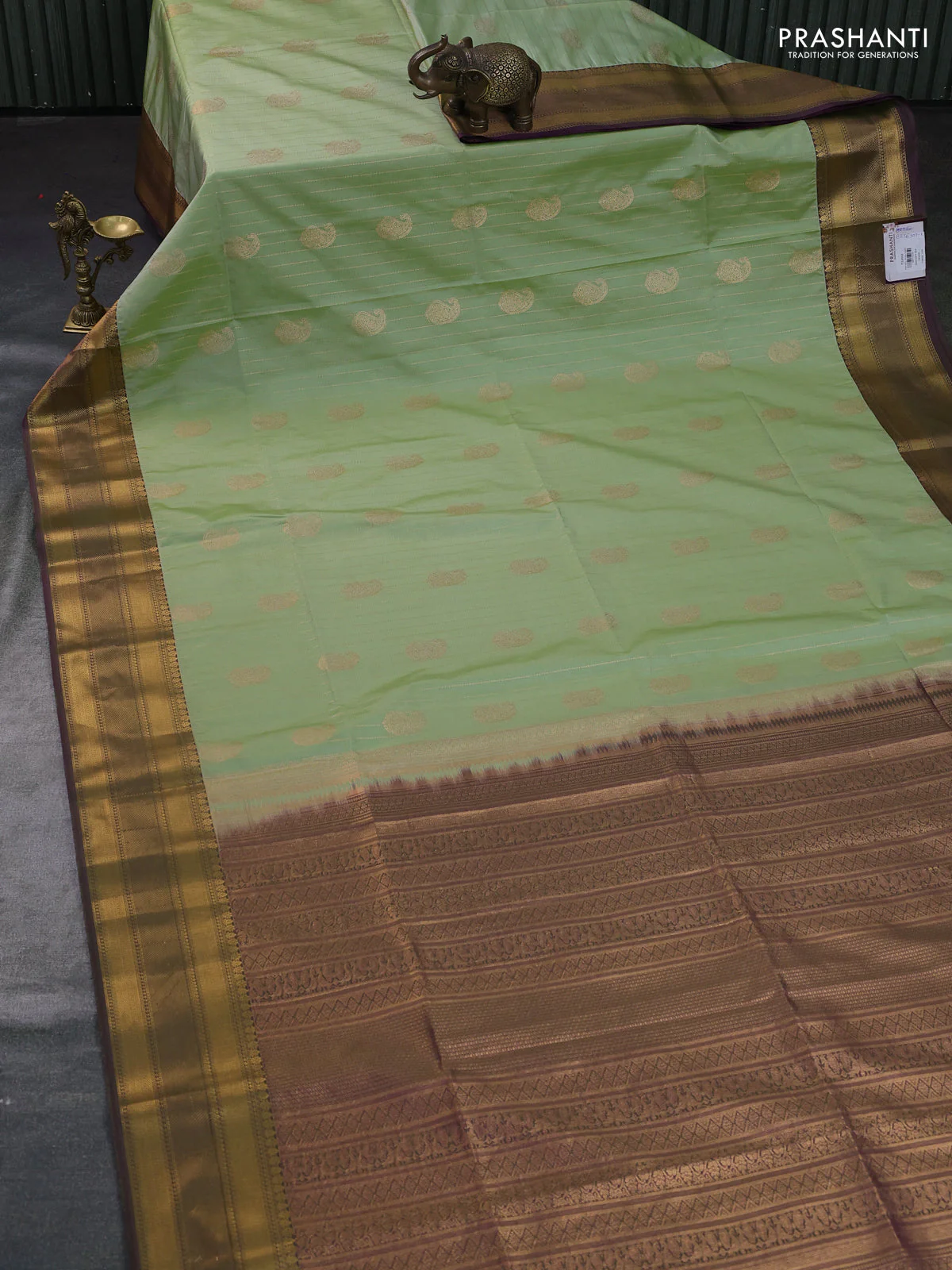 Semi soft silk saree pista green and dual shade of greenish purple with allover zari weaves & buttas and zari woven border - Image 2