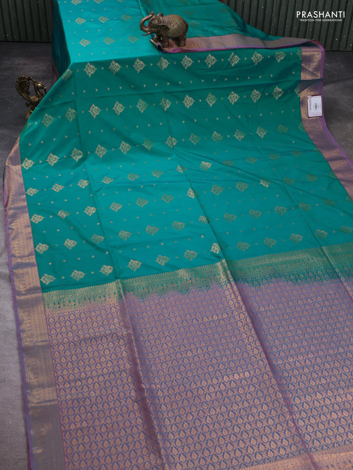 Semi soft silk saree teal green and peach shade with allover zari woven buttas and zari woven korvai border - Image 2