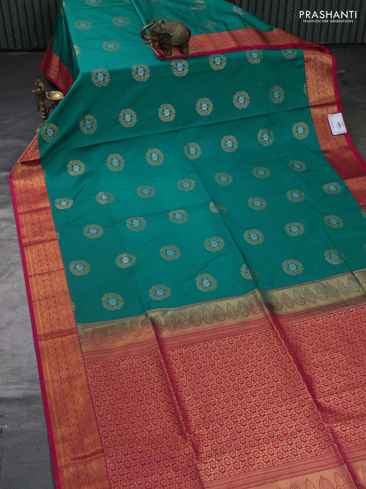 Semi soft silk saree teal green and pink with allover rudraksha zari woven buttas and zari woven korvai border - Image 2