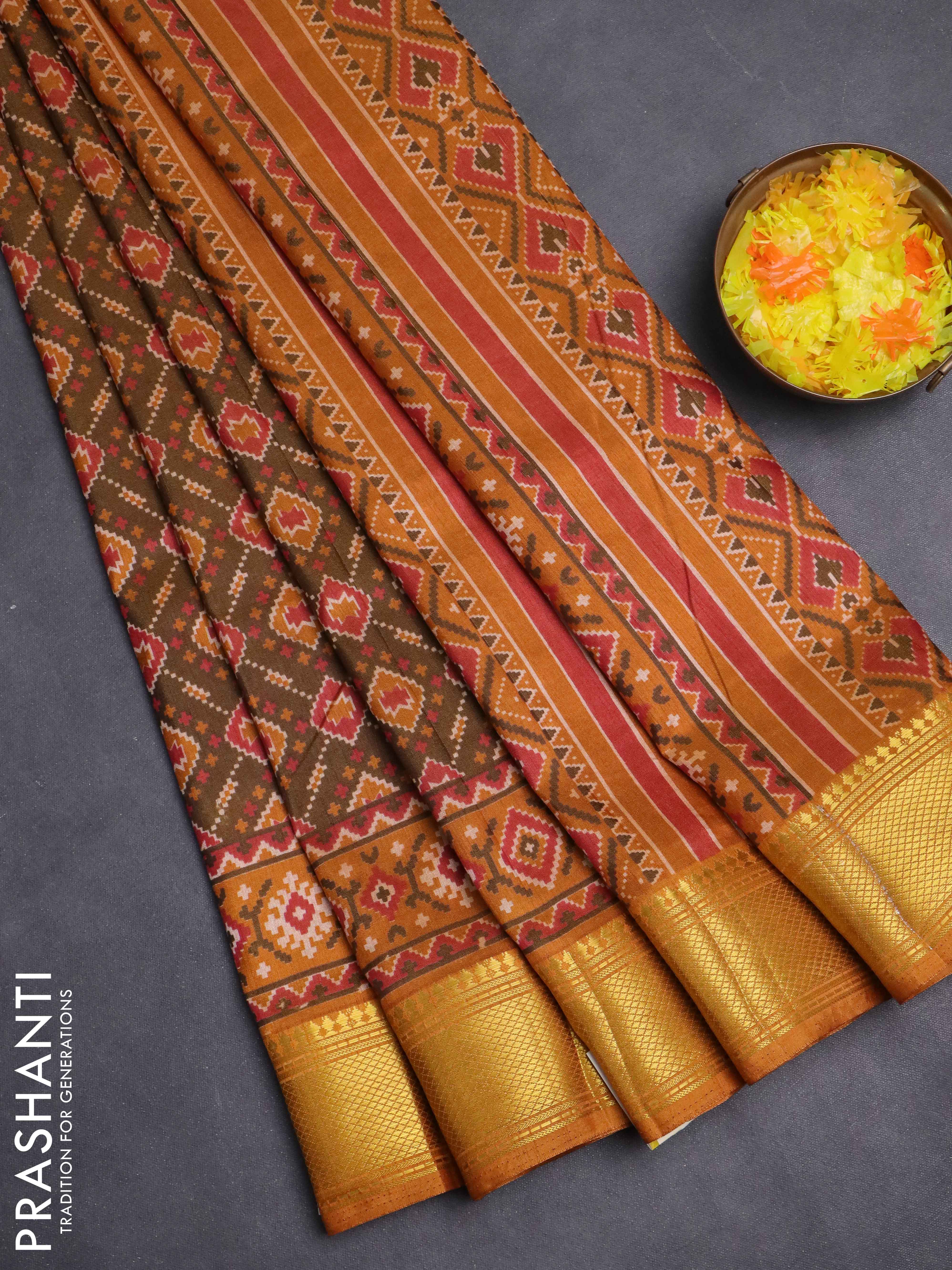 Semi tussar saree dual shade of brown and dark mustard with allover ikat prints and zari woven border