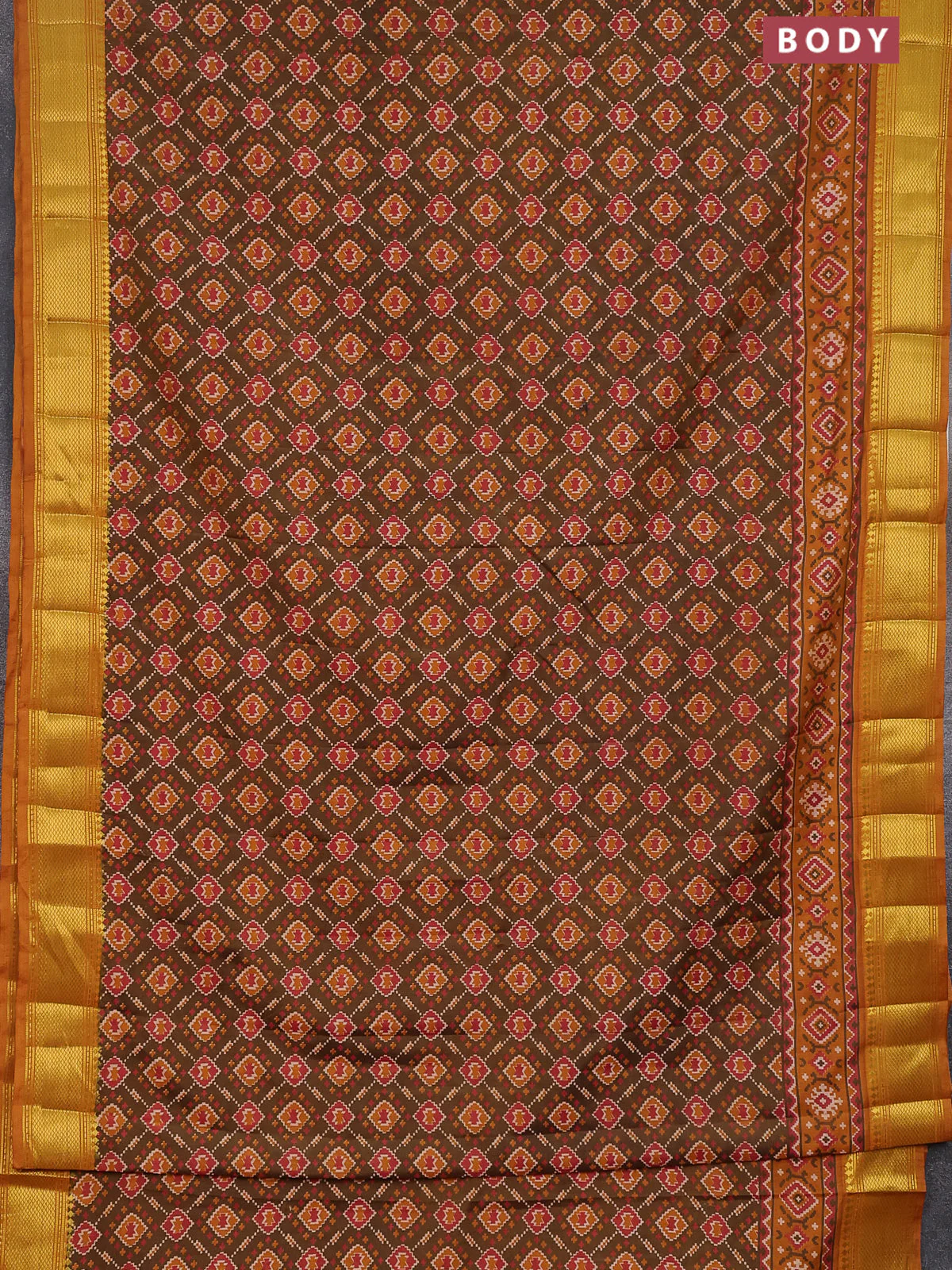 Semi tussar saree dual shade of brown and dark mustard with allover ikat prints and zari woven border - Image 2