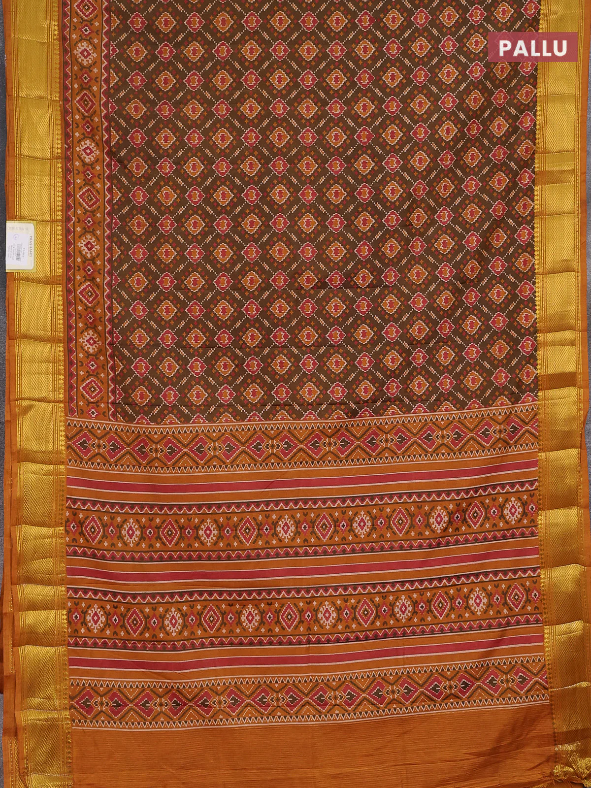 Semi tussar saree dual shade of brown and dark mustard with allover ikat prints and zari woven border - Image 3