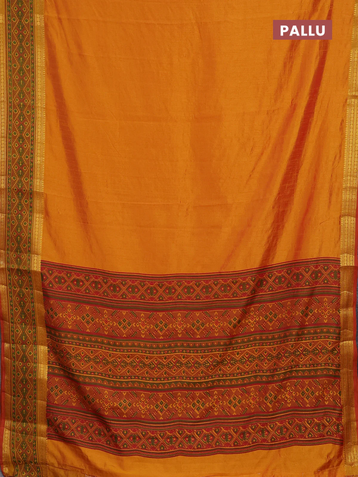 Semi tussar saree dual shade of mustard yellow and red with plain body and ikat woven zari border - Image 3