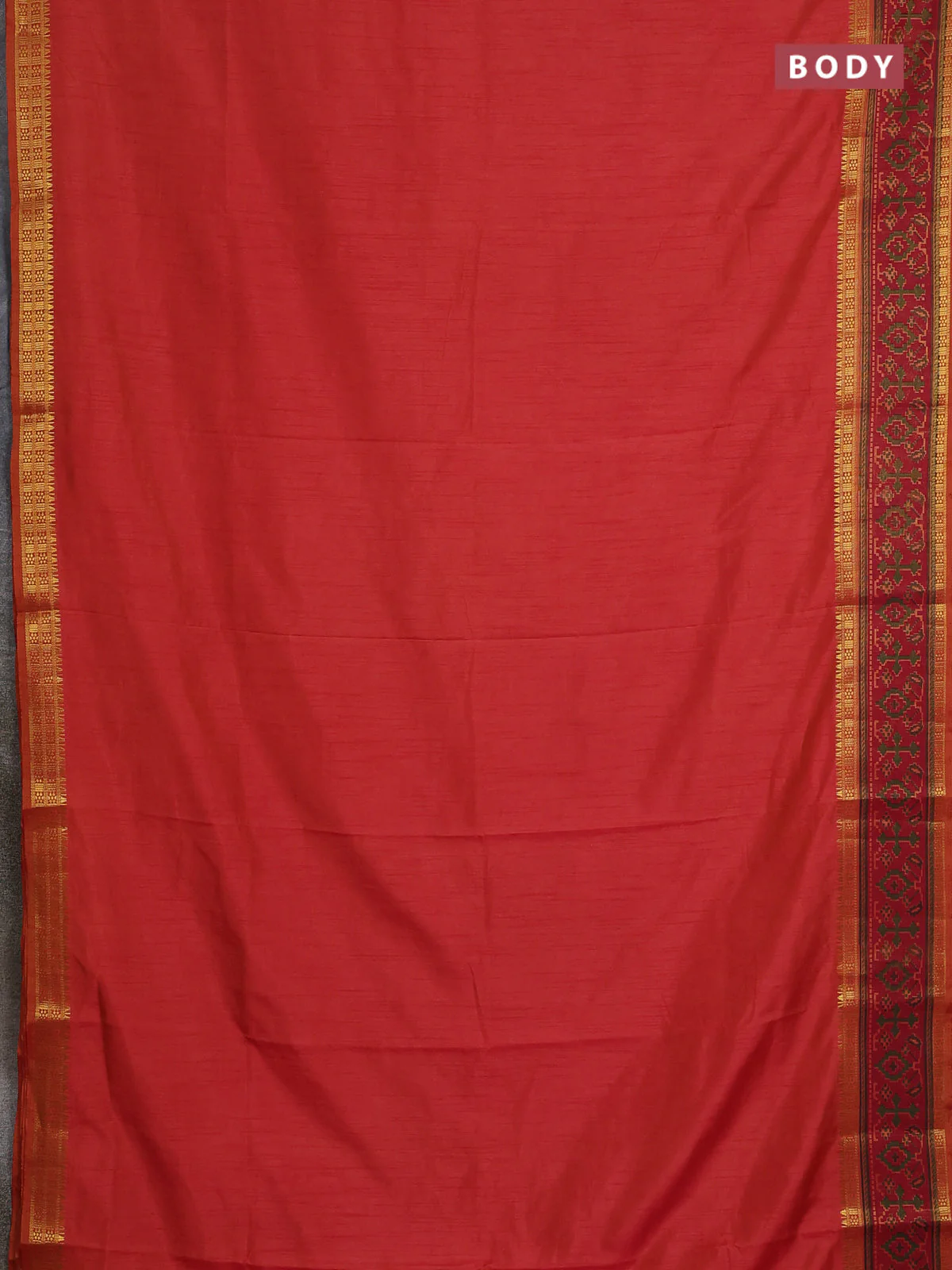 Semi tussar saree dual shade of pinkish orange and maroon with plain body and ikat woven zari border - Image 2
