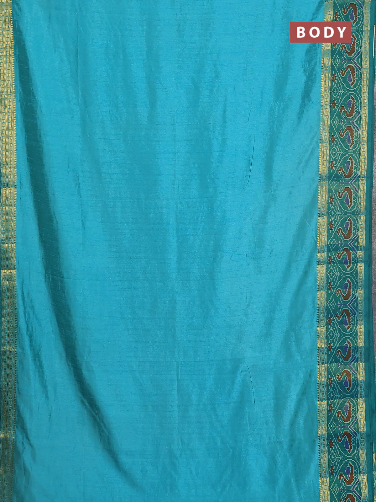 Semi tussar saree dual shade of teal blue and green with plain body and ikat woven zari border - Image 2