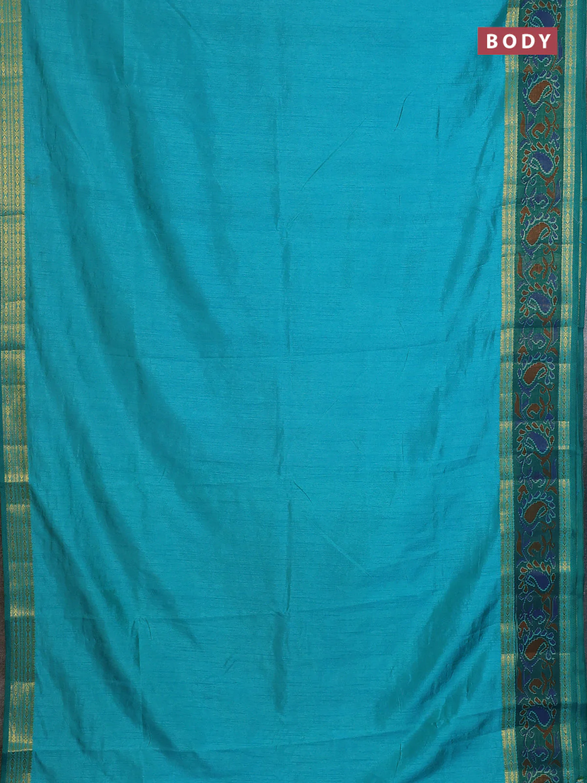 Semi tussar saree dual shade of teal blue and green with plain body and ikat woven zari border - Image 2