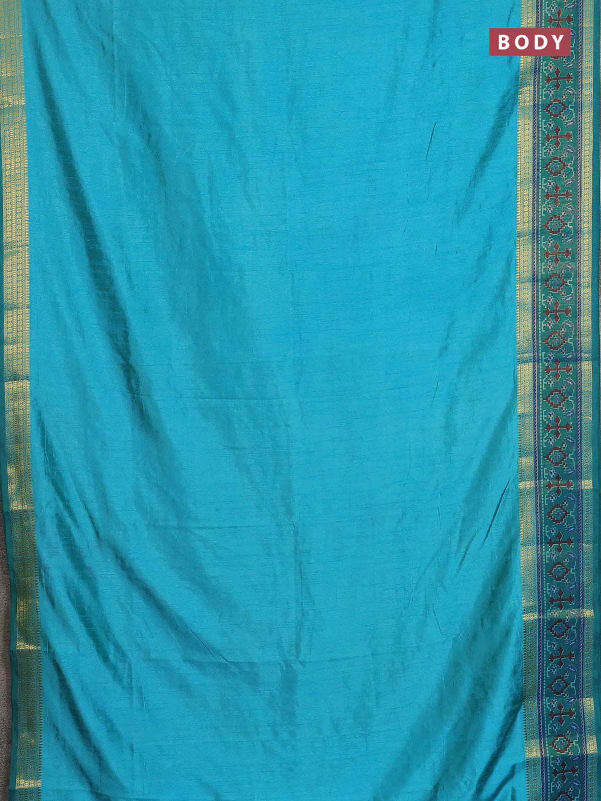 Semi tussar saree dual shade of teal blue and green with plain body and ikat woven zari border - Image 2
