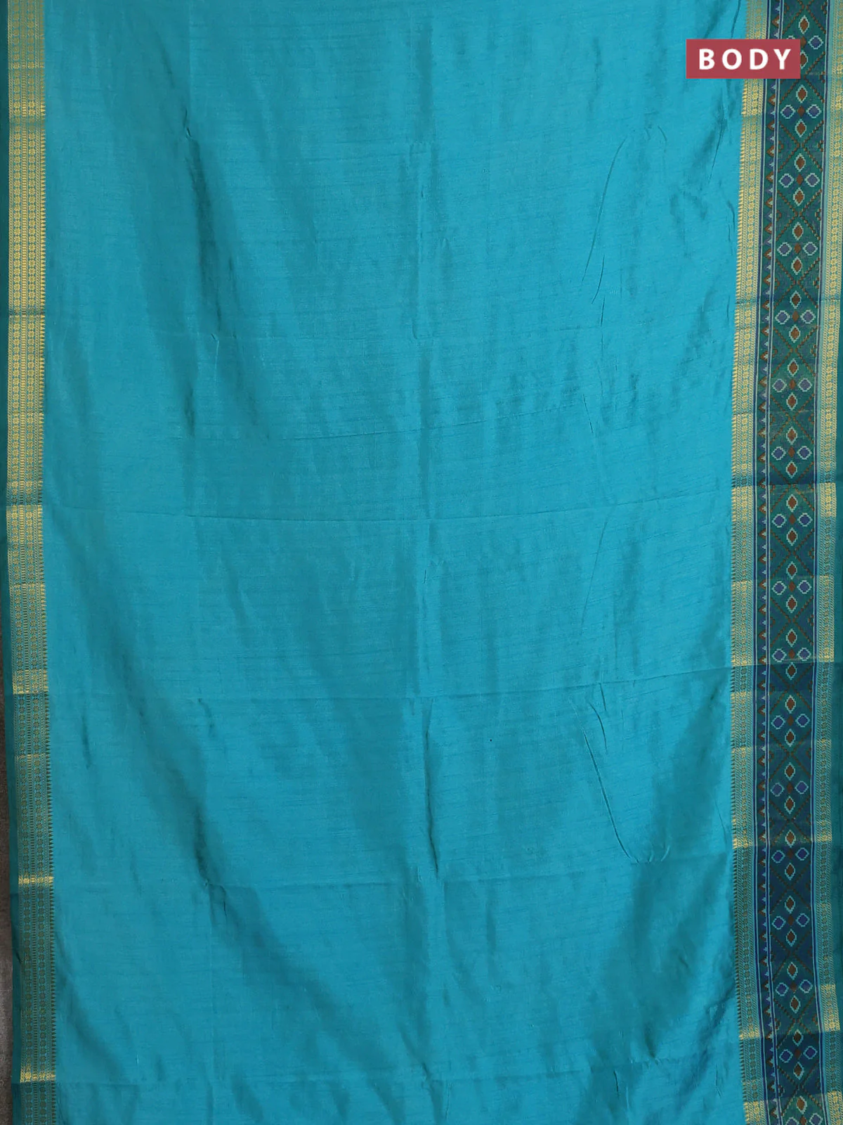 Semi tussar saree dual shade of teal blue and green with plain body and ikat woven zari border - Image 2
