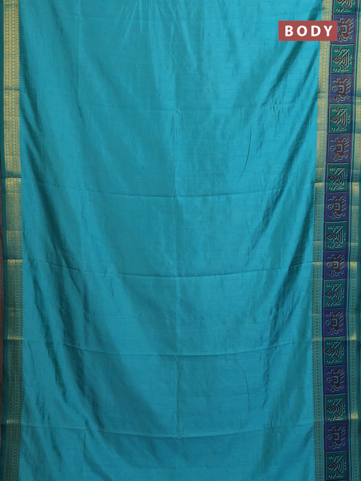 Semi tussar saree dual shade of teal blue with plain body and ikat woven zari border - Image 2