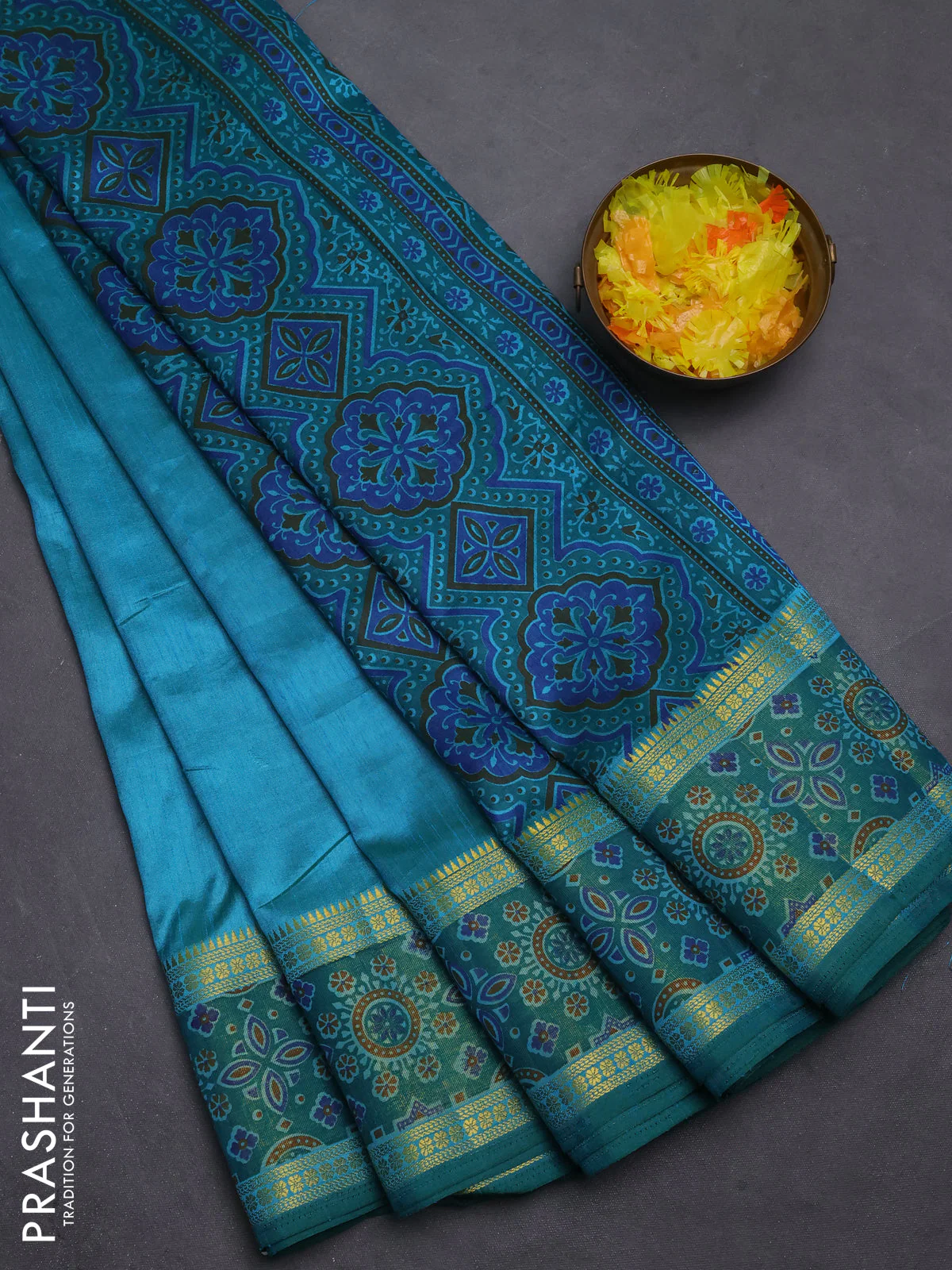 Semi tussar saree dual shade of teal blue with plain body and ikat woven zari border