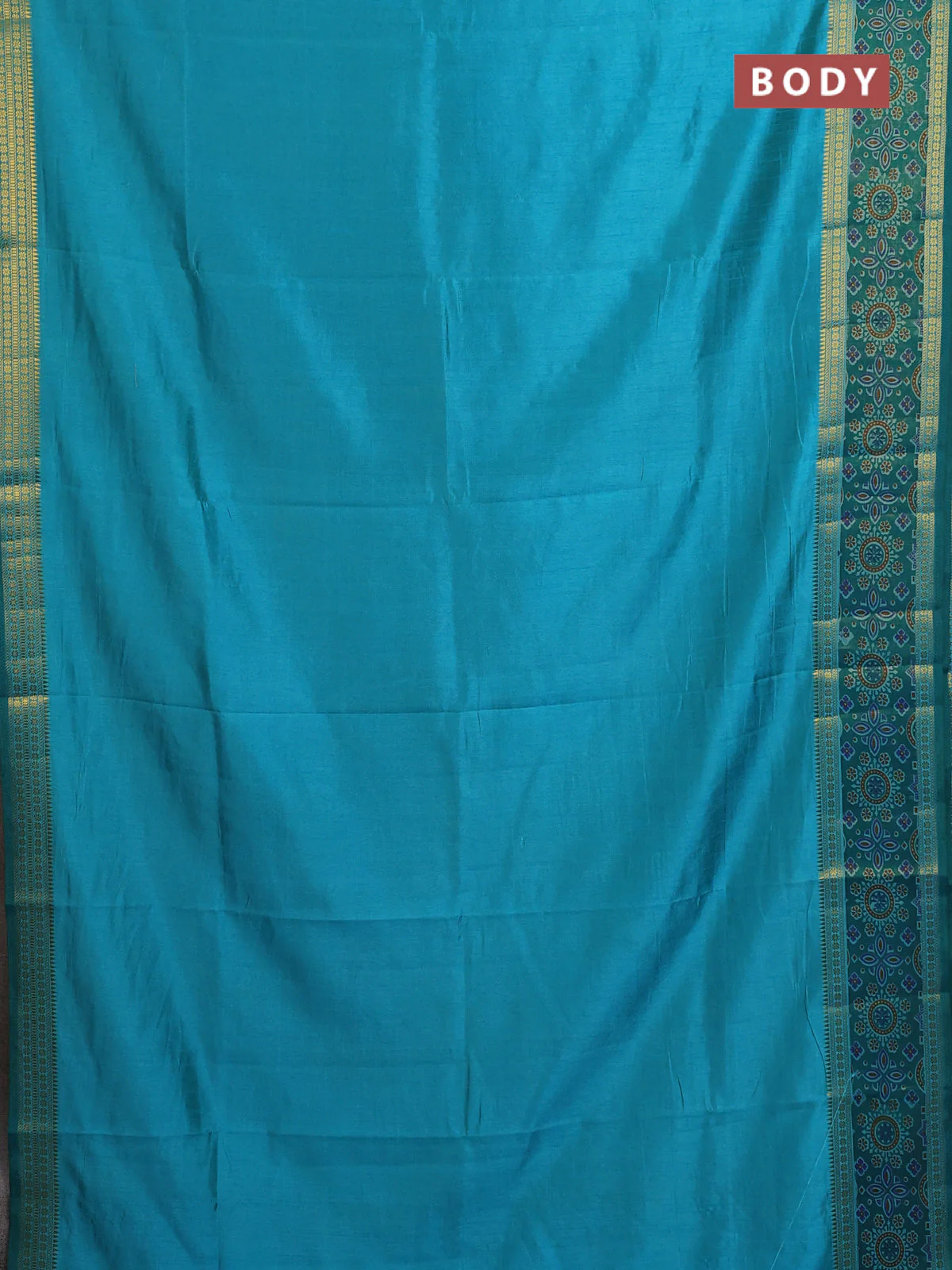 Semi tussar saree dual shade of teal blue with plain body and ikat woven zari border - Image 2