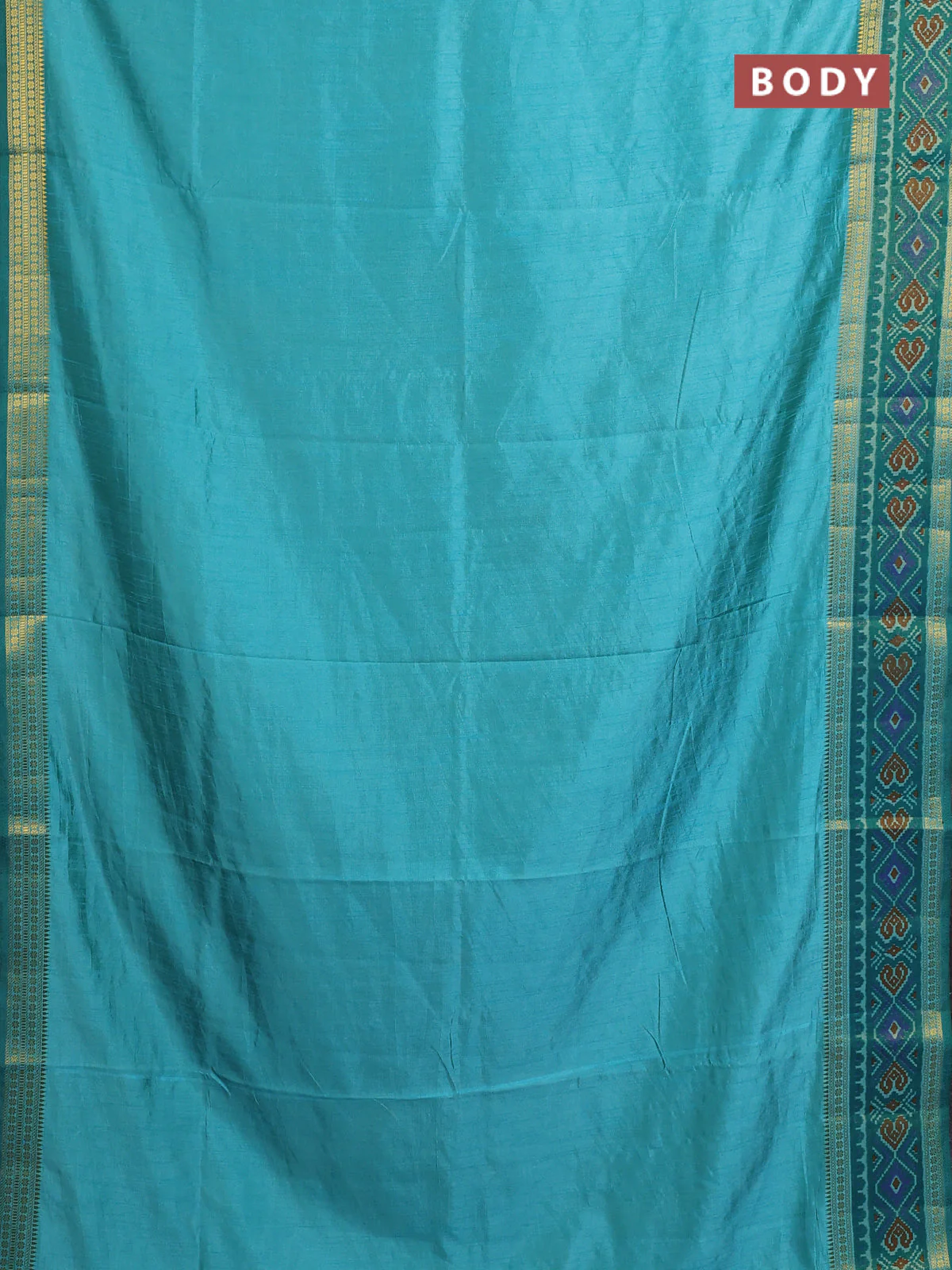 Semi tussar saree dual shade of teal blue with plain body and ikat woven zari border - Image 2