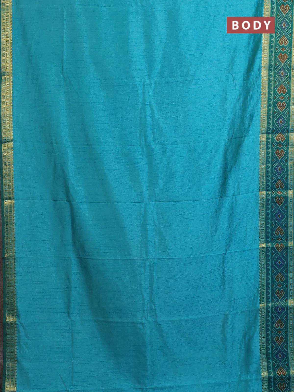 Semi tussar saree dual shade of teal blue with plain body and ikat woven zari border - Image 2